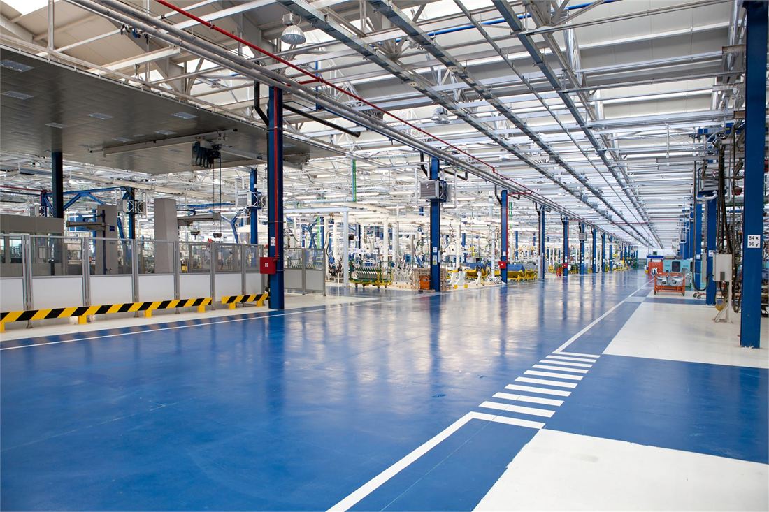 A brightly lit industrial facility floor